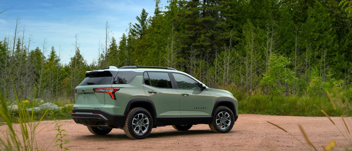 2026 Chevy Equinox parked in forest clearing