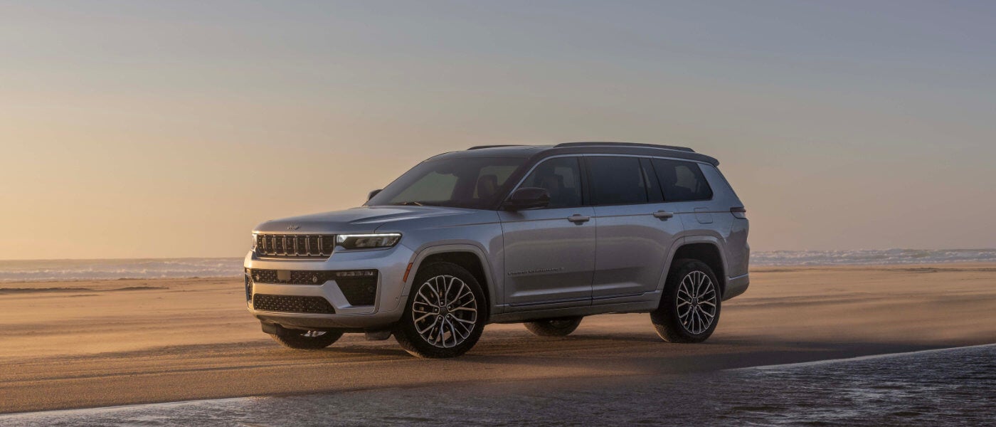 2026 Jeep Grand Cherokee parked by ocean edge